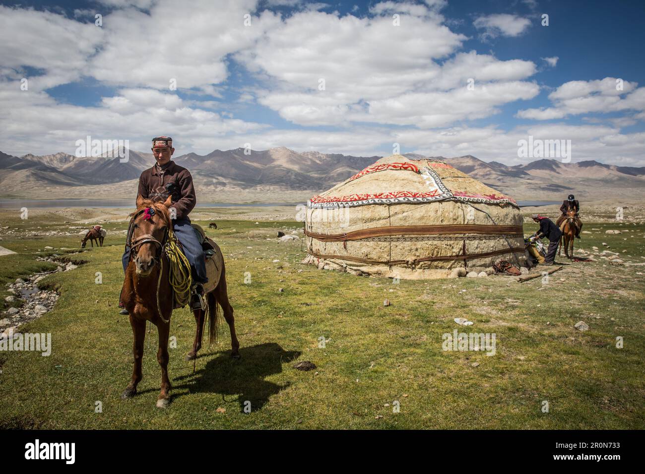 Kirgise on horse in front of yurt, Pamir, Afghanistan, Asia Stock Photo