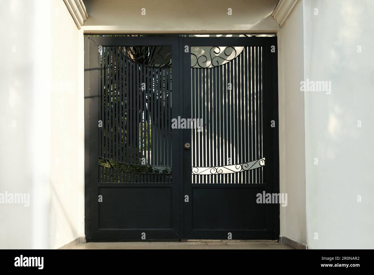 Entrance of residential house with black door Stock Photo - Alamy