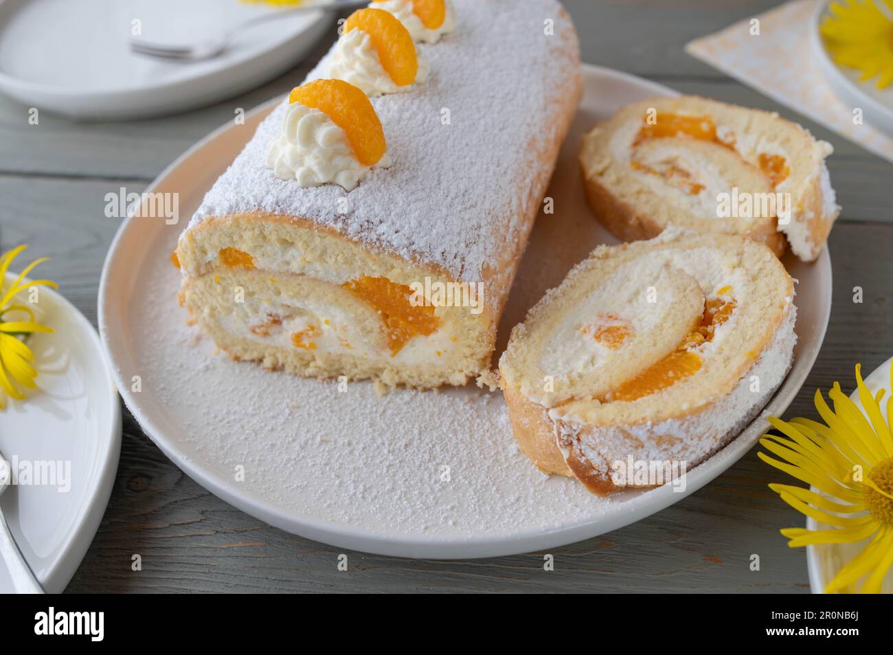 Swiss roll with mandarins and whipped cream filling Stock Photo Alamy