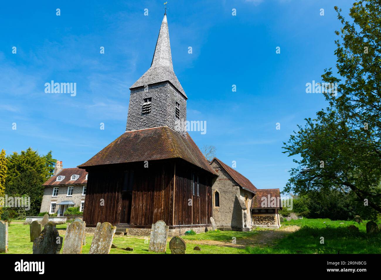 St. Margaret's church, Church Lane, Margaretting, Essex, UK. C15 Timber-framed, weatherboarded and shingled west tower with a broach spire Stock Photo