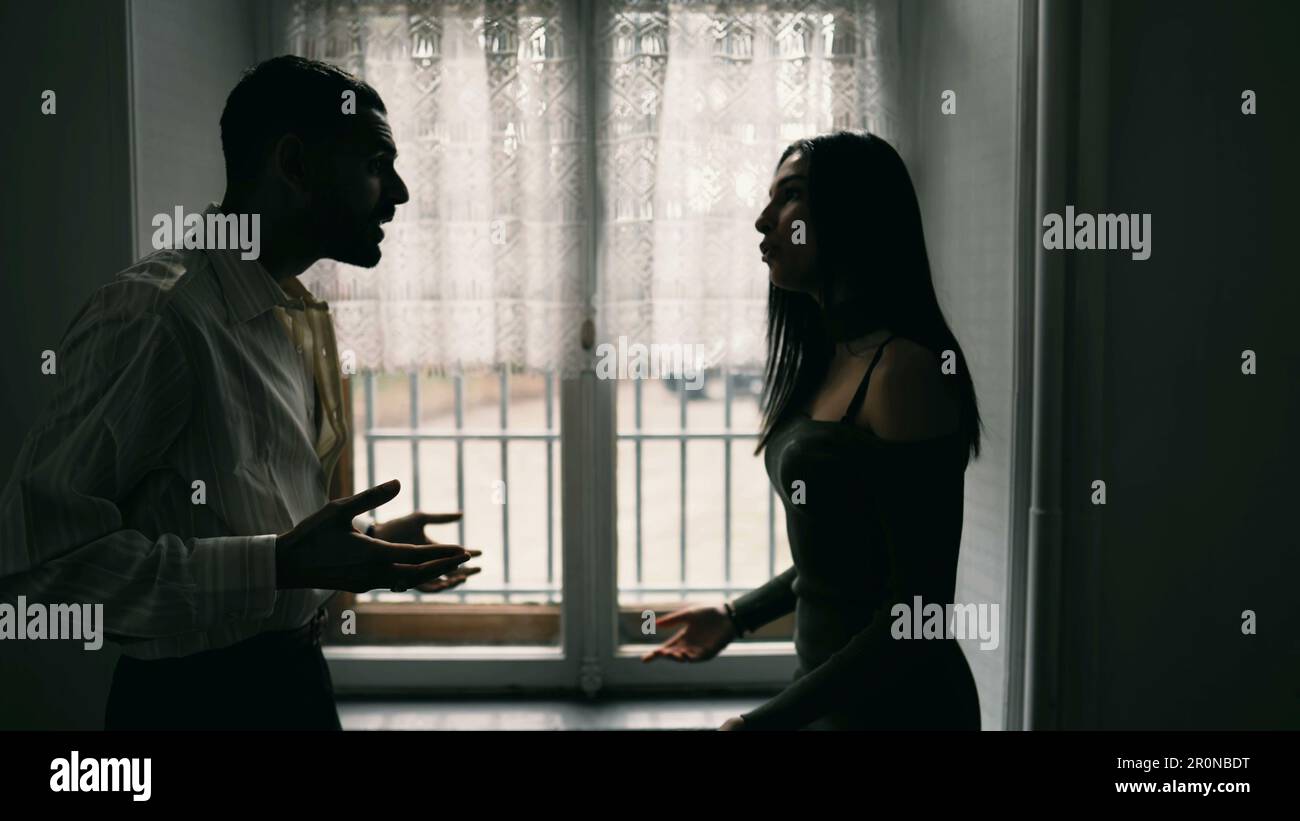 Angry man shouting at woman. Dramatic scene of couple yelling at 