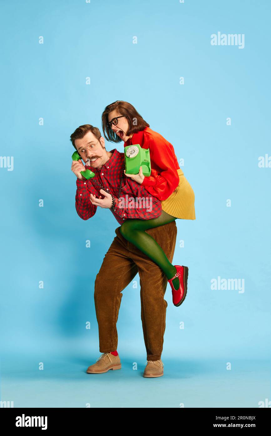 Portrait of family, man and woman wearing retro style clothes arguing ...