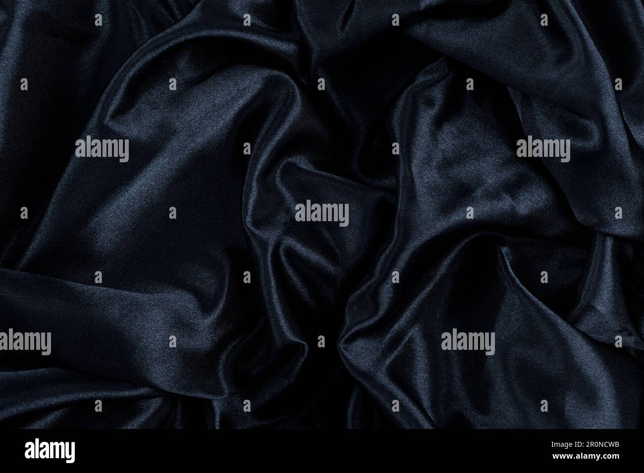 Abstract background black fabric, wavy folds. Texture background Stock Photo