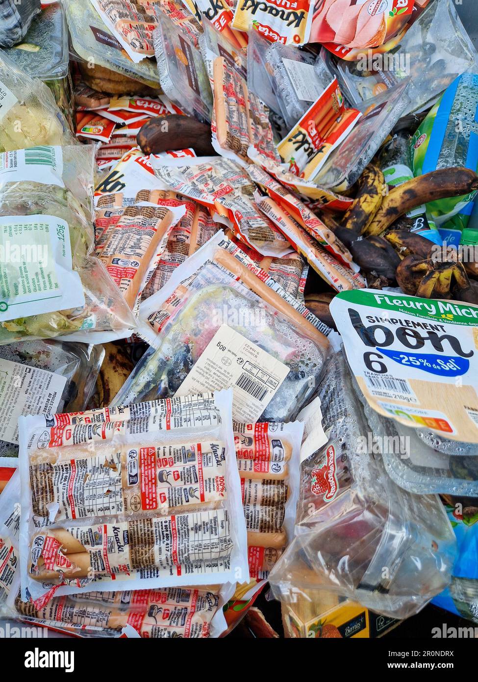 Expired foods in a garbage dumpster, Lyon, France Stock Photo Alamy