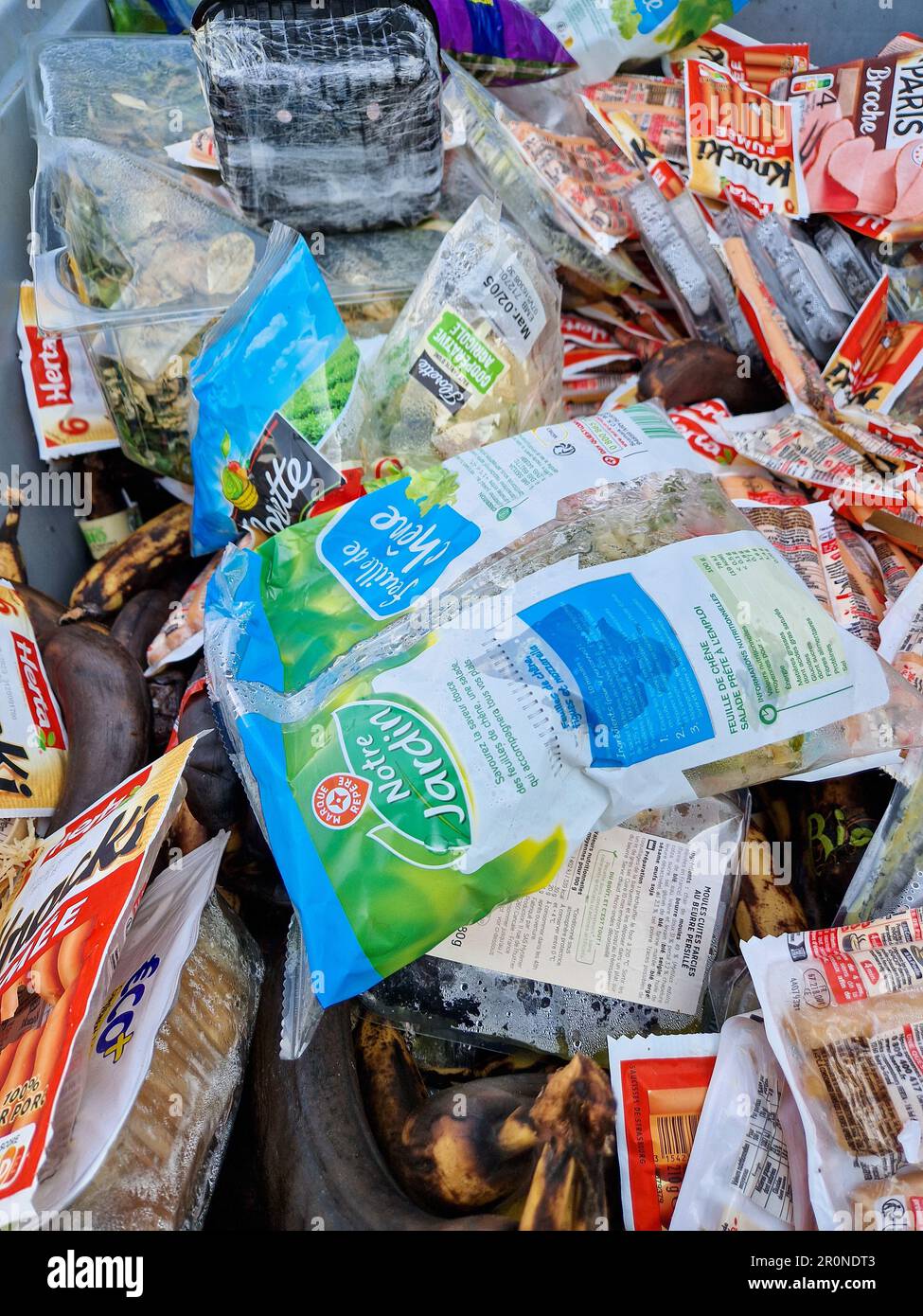 Expired foods in a garbage dumpster, Lyon, France Stock Photo Alamy