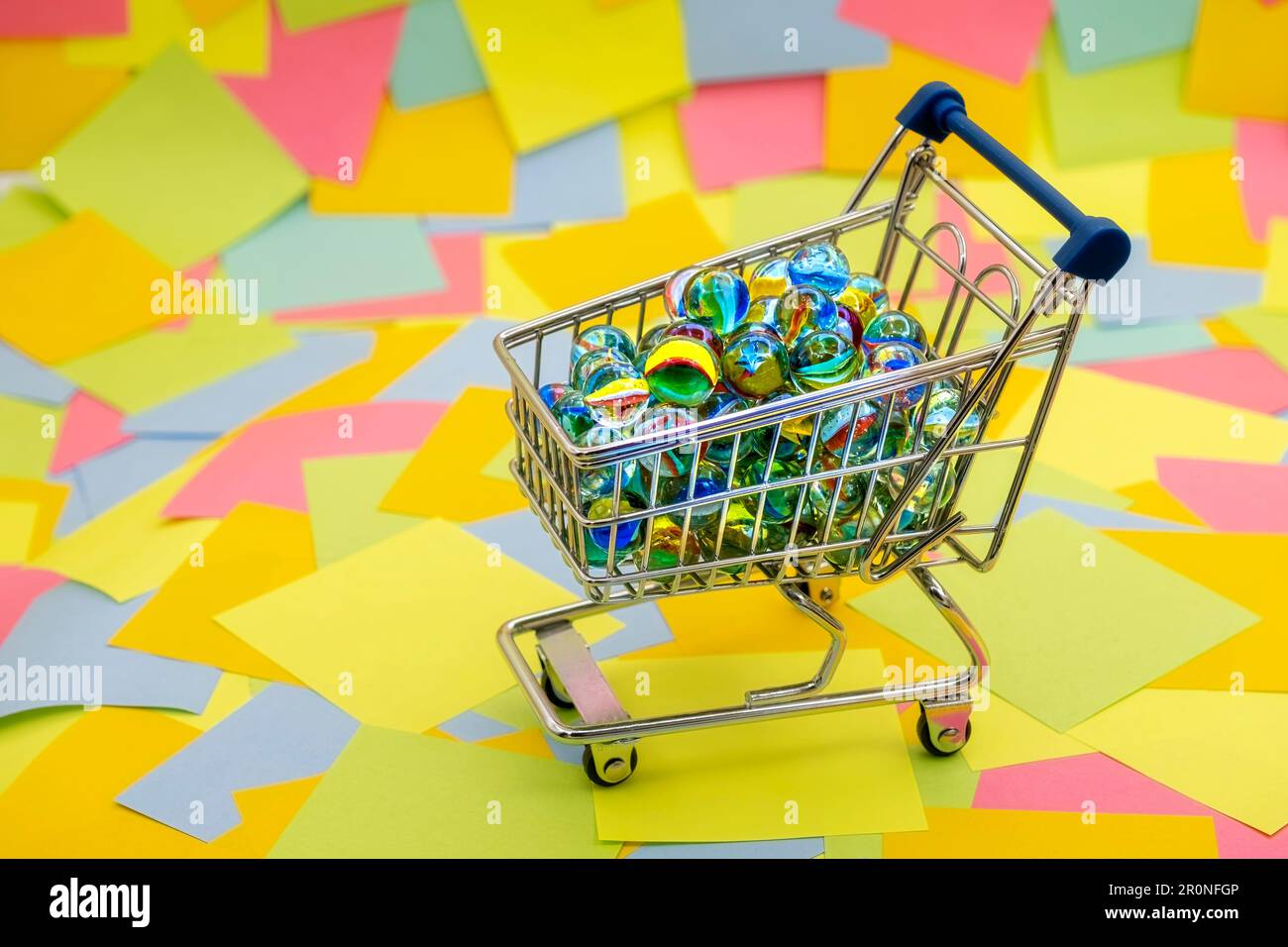 an shopping cart with decorative glass balls on a background of ...