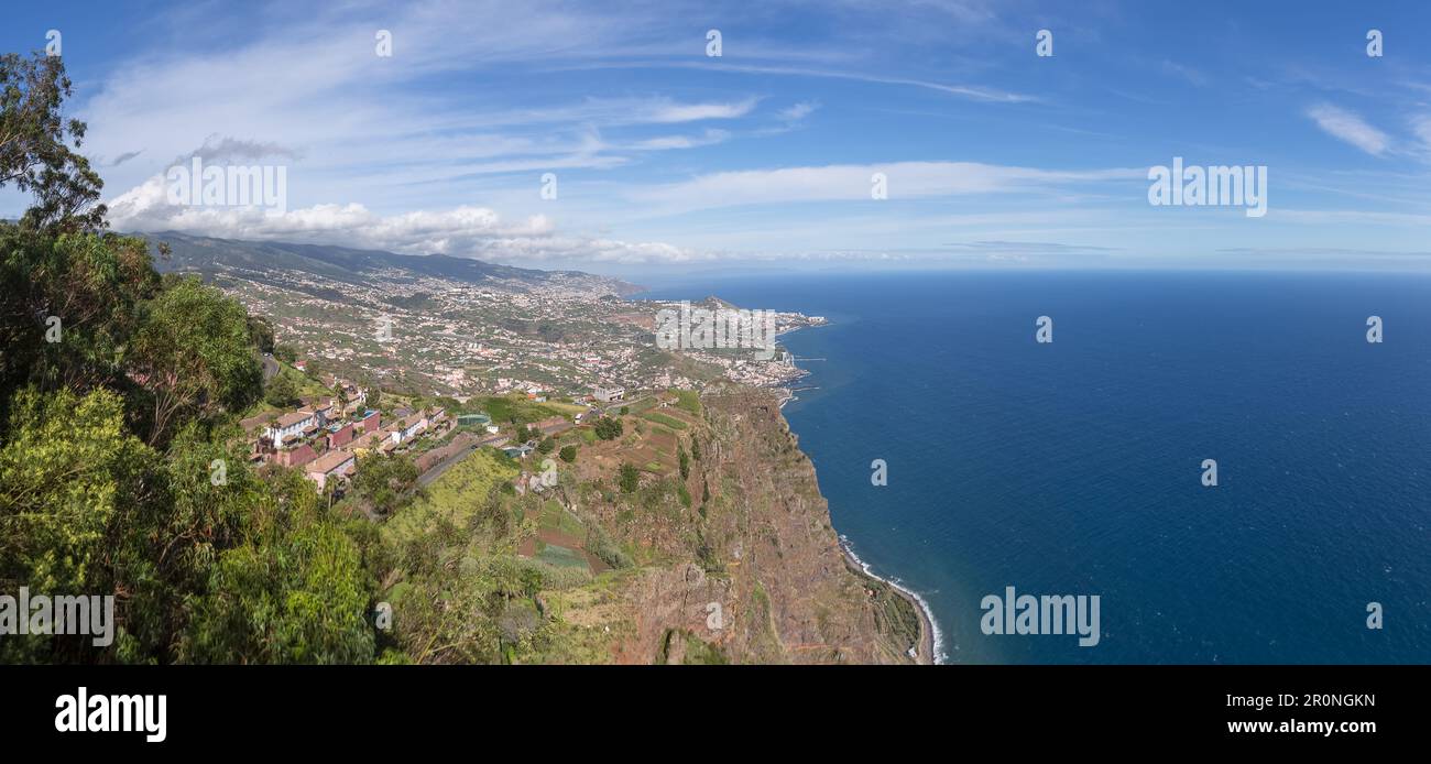 Madeira Island Portugal - 04 21 2023: Full panoramic aerial view of the city of Funchal and Camara de Lobos, tourist and iconic city on the island of Stock Photo