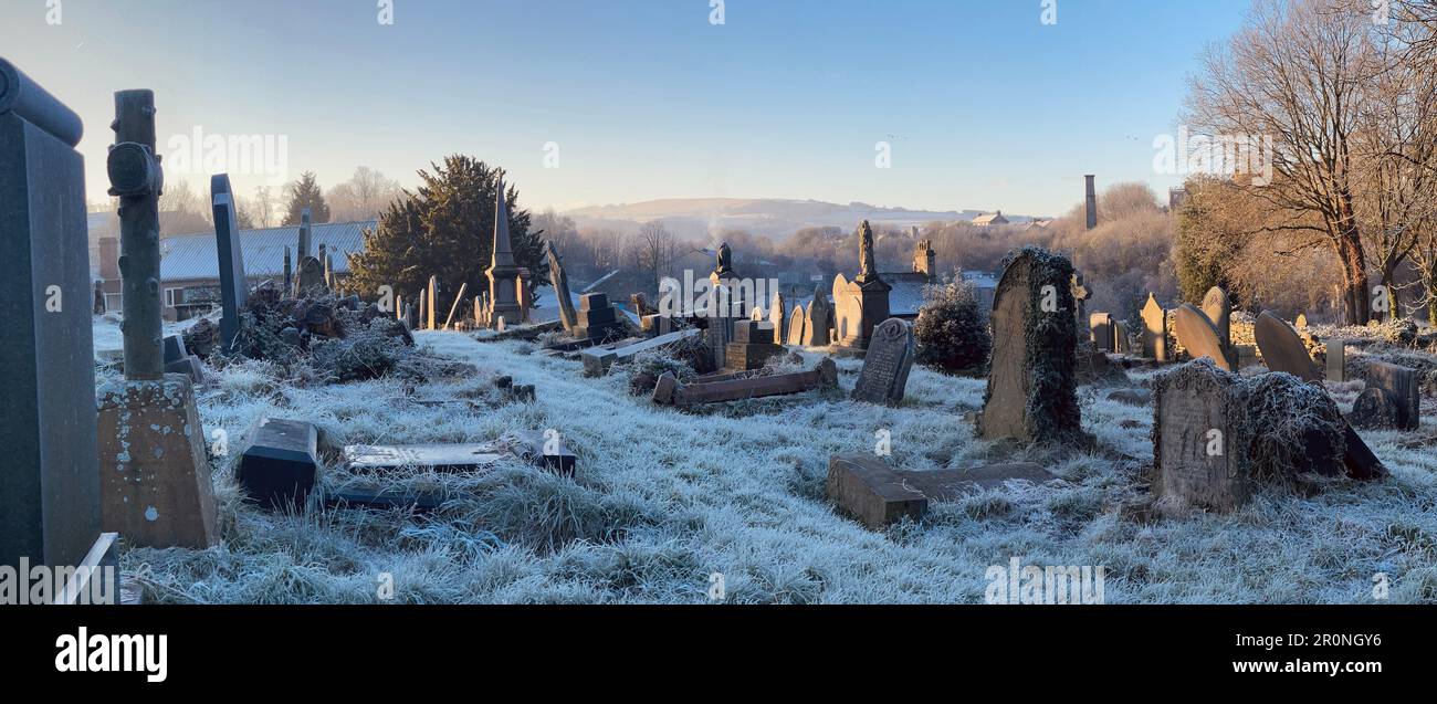 Frost covered graveyard on a winters morning in the churchyard of the old Methodist Church on St George's Road. Leaning gravestones at strange angles. Stock Photo
