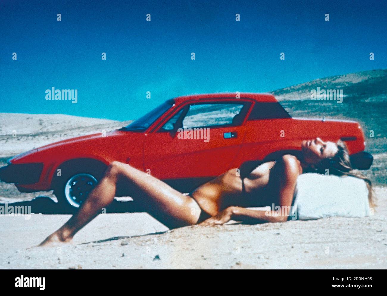 Advertisement poster of the Triumph TR7 car and girl in bikini