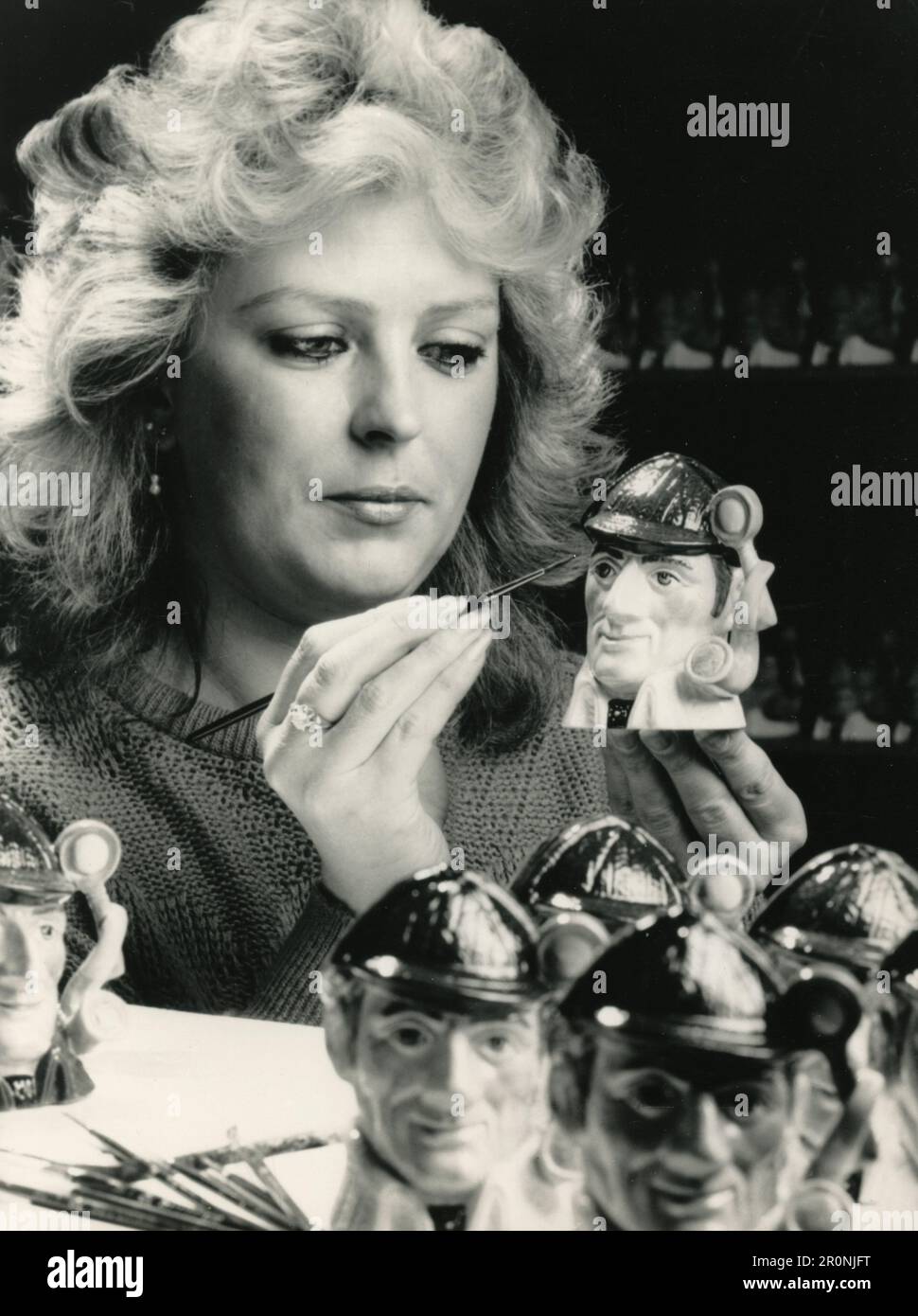 British pottery handpainter Linda Bailey decorating Sherlock Holmes figures, UK 1987 Stock Photo