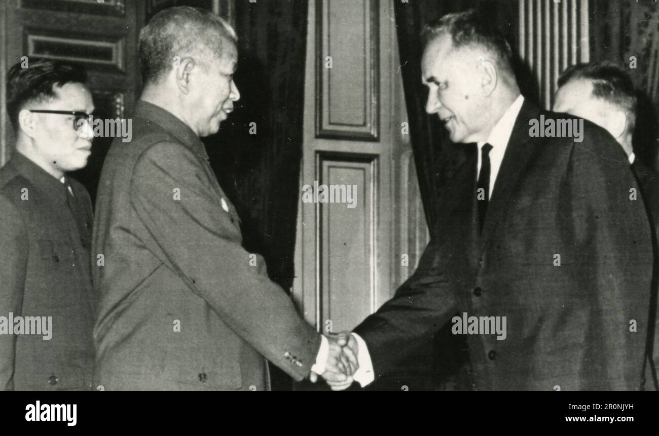 Chinese ambassador to France shaking hands with Soviet Premier Alexei