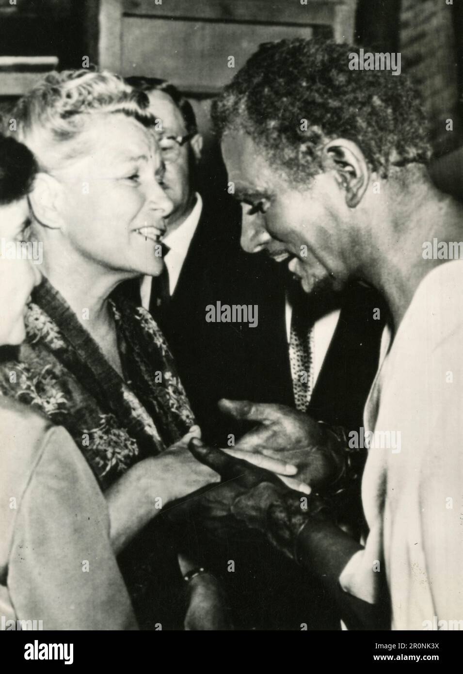 Unidentified Cultural Affairs woman Minister greeting unidentified black man, Moscow, Russia 1966 Stock Photo