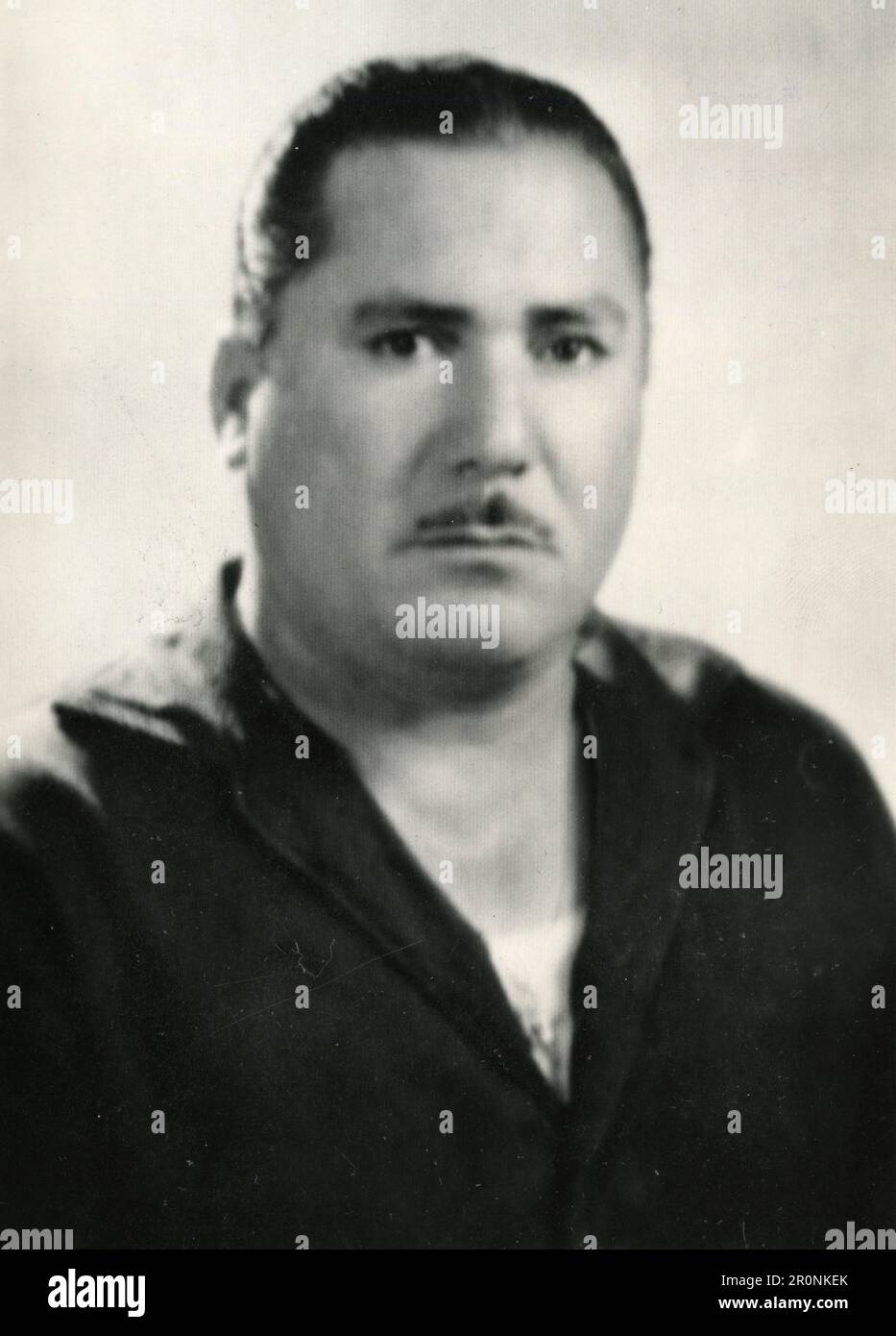 portrait-of-a-gentleman-with-tiny-moustache-and-slicked-back-hair