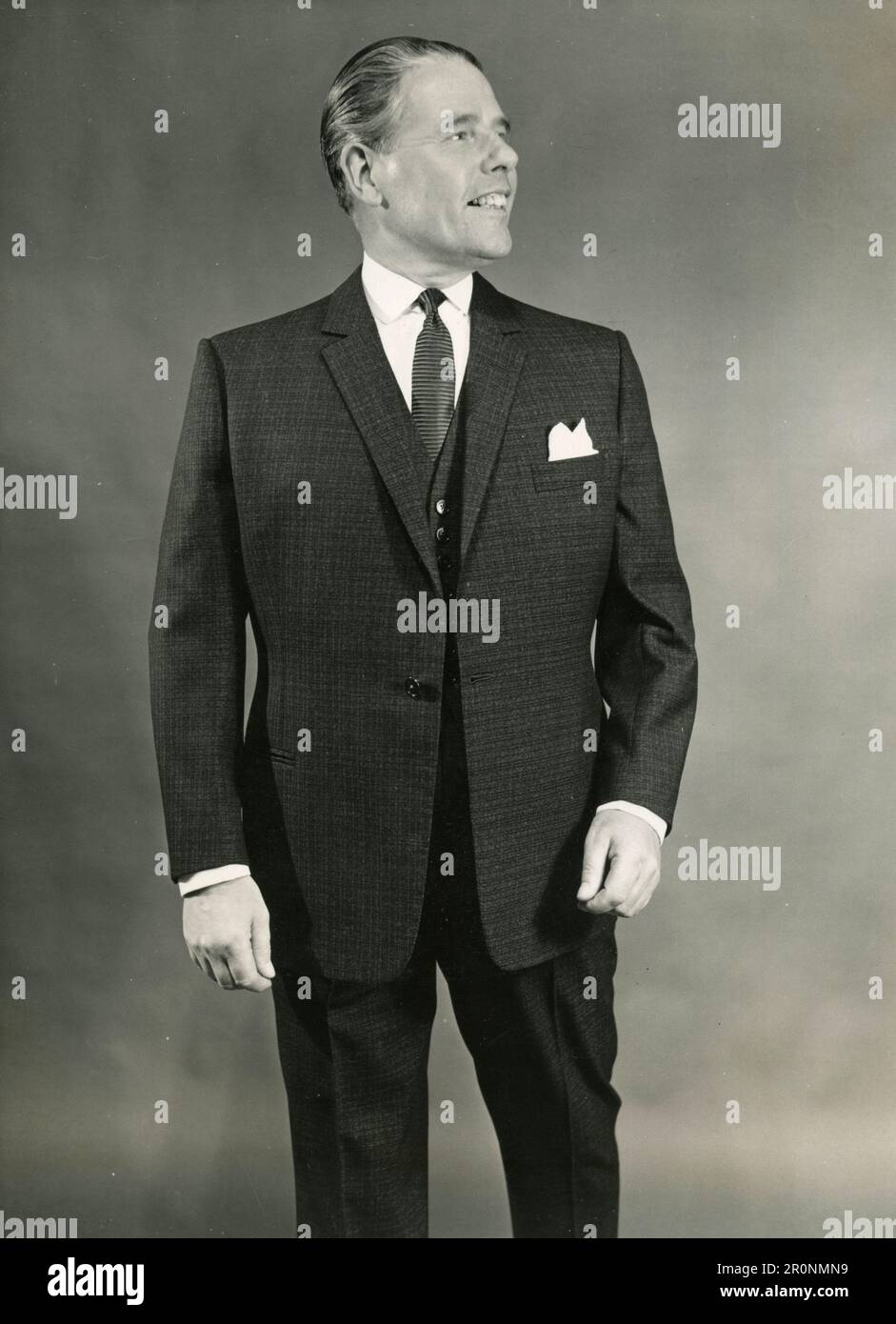 Men's Fashion: Model wearing a brown check worsted single brested suit with  old gold lining by British designer J.J. Royal of Hawes and Curtis, UK 1965  Stock Photo - Alamy