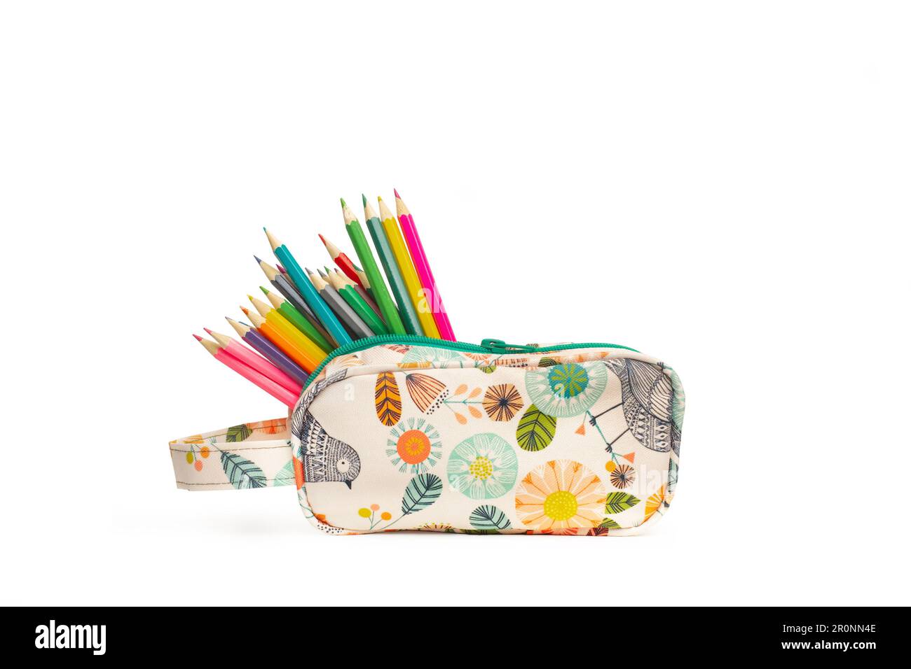 Color pencils in a colored plant print hand bag on a white background with copy space Stock Photo