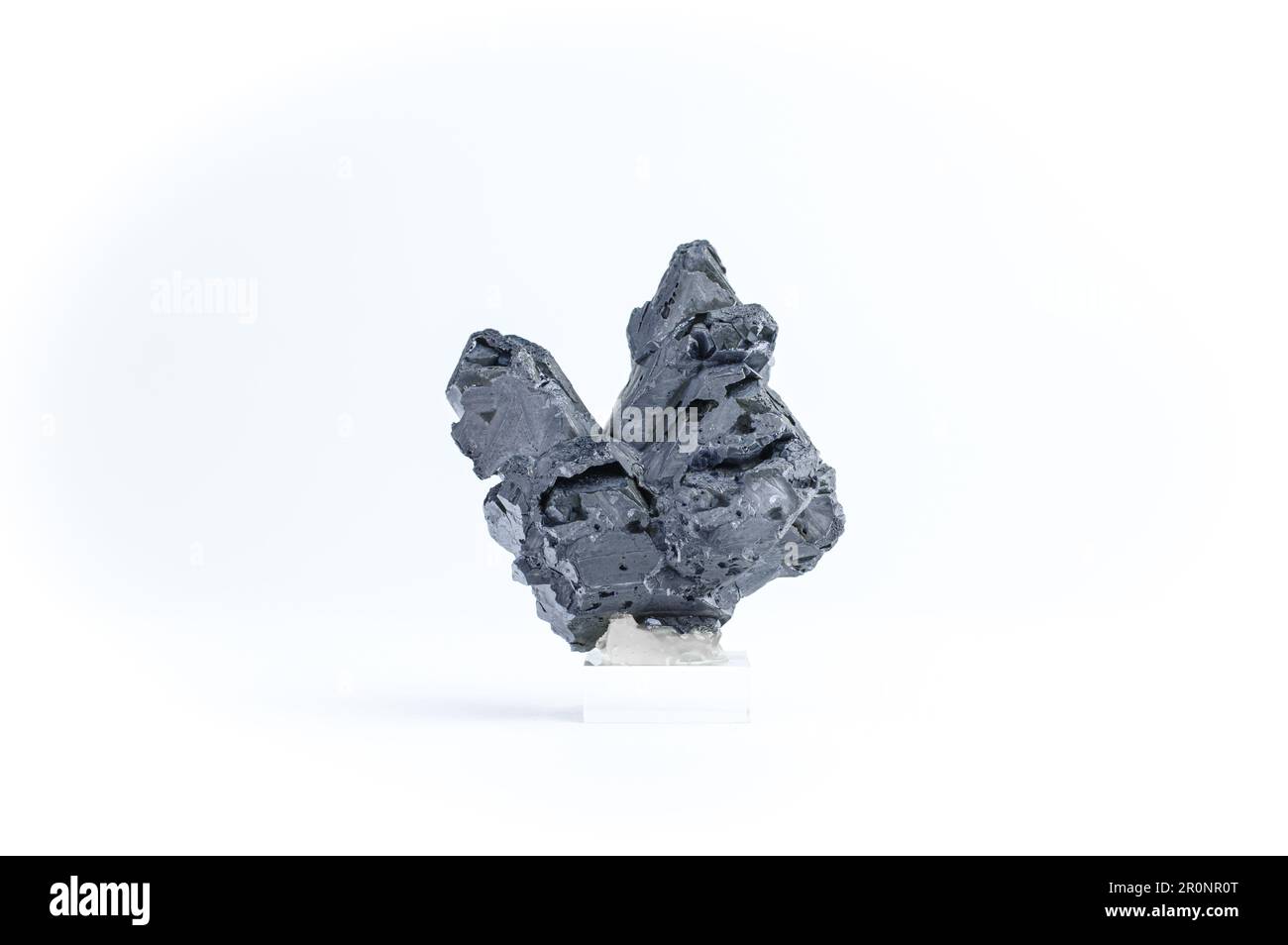 Galena macro detail white isolated background. close-up Rough raw unpolished semi-precious gemstone lead ore. Stock Photo