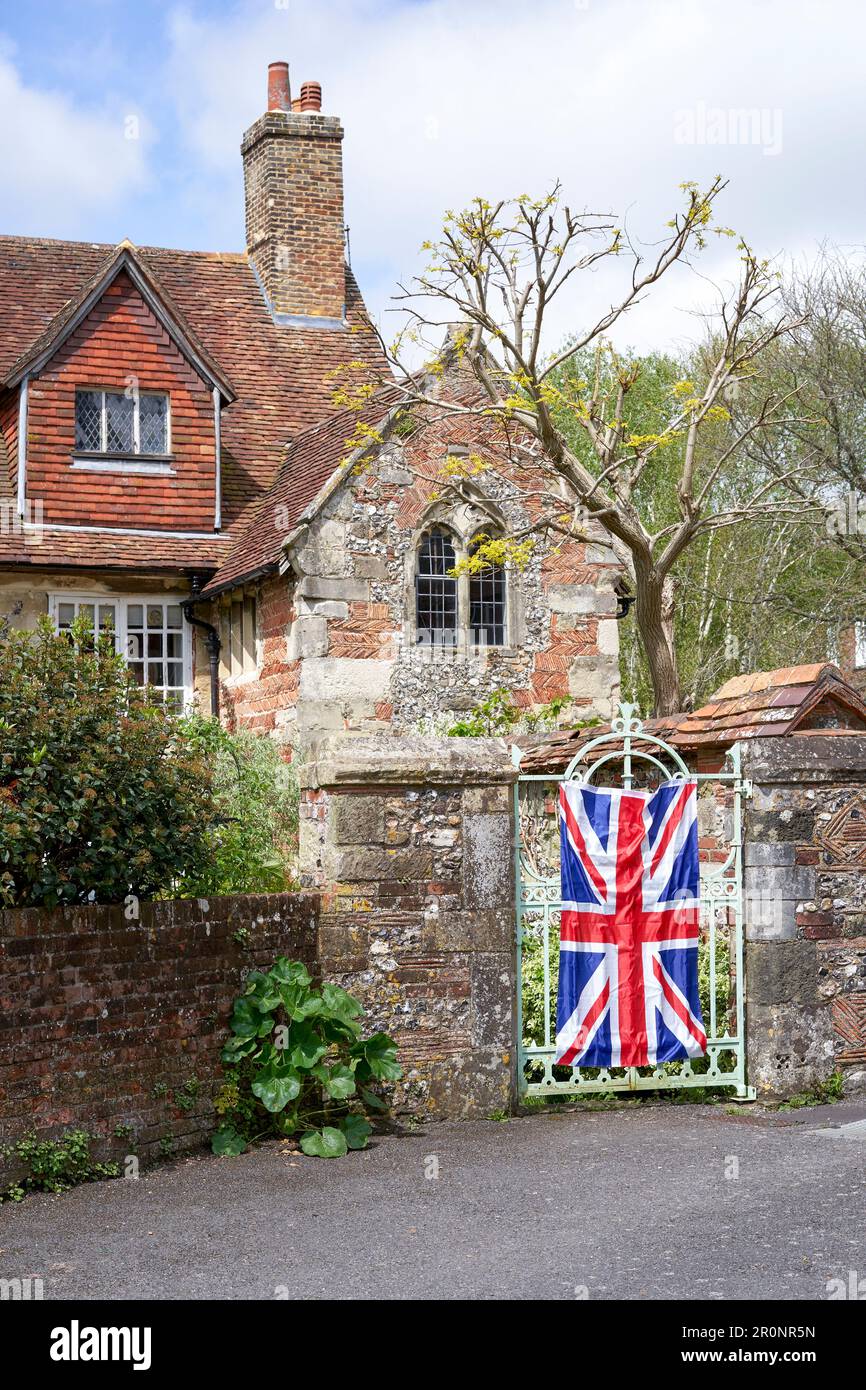 British Union Jack flag draped over a metal gate as part of the coronation celebrations Stock Photo