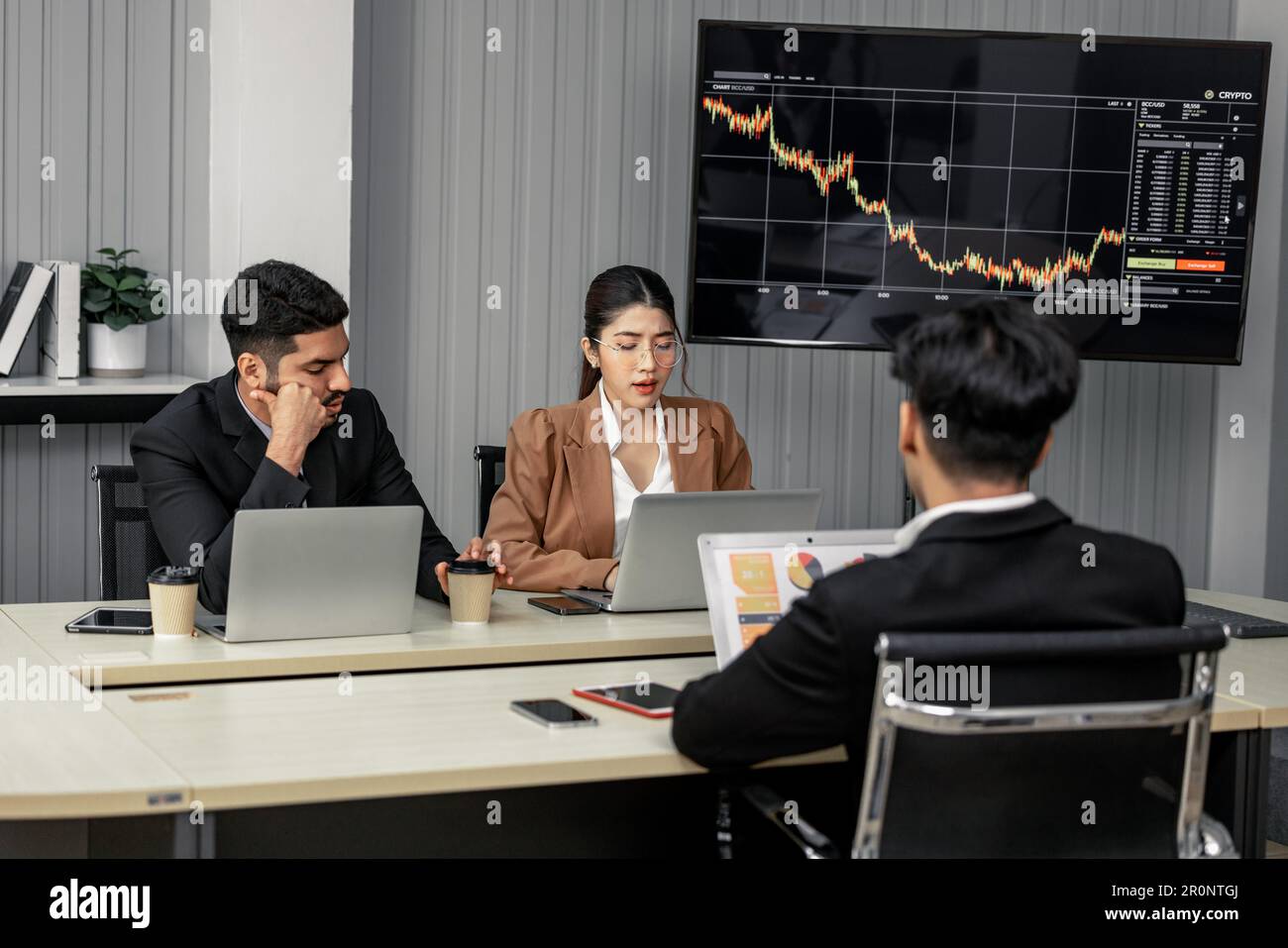Financial advisors collaborate to assess a company's financial ...