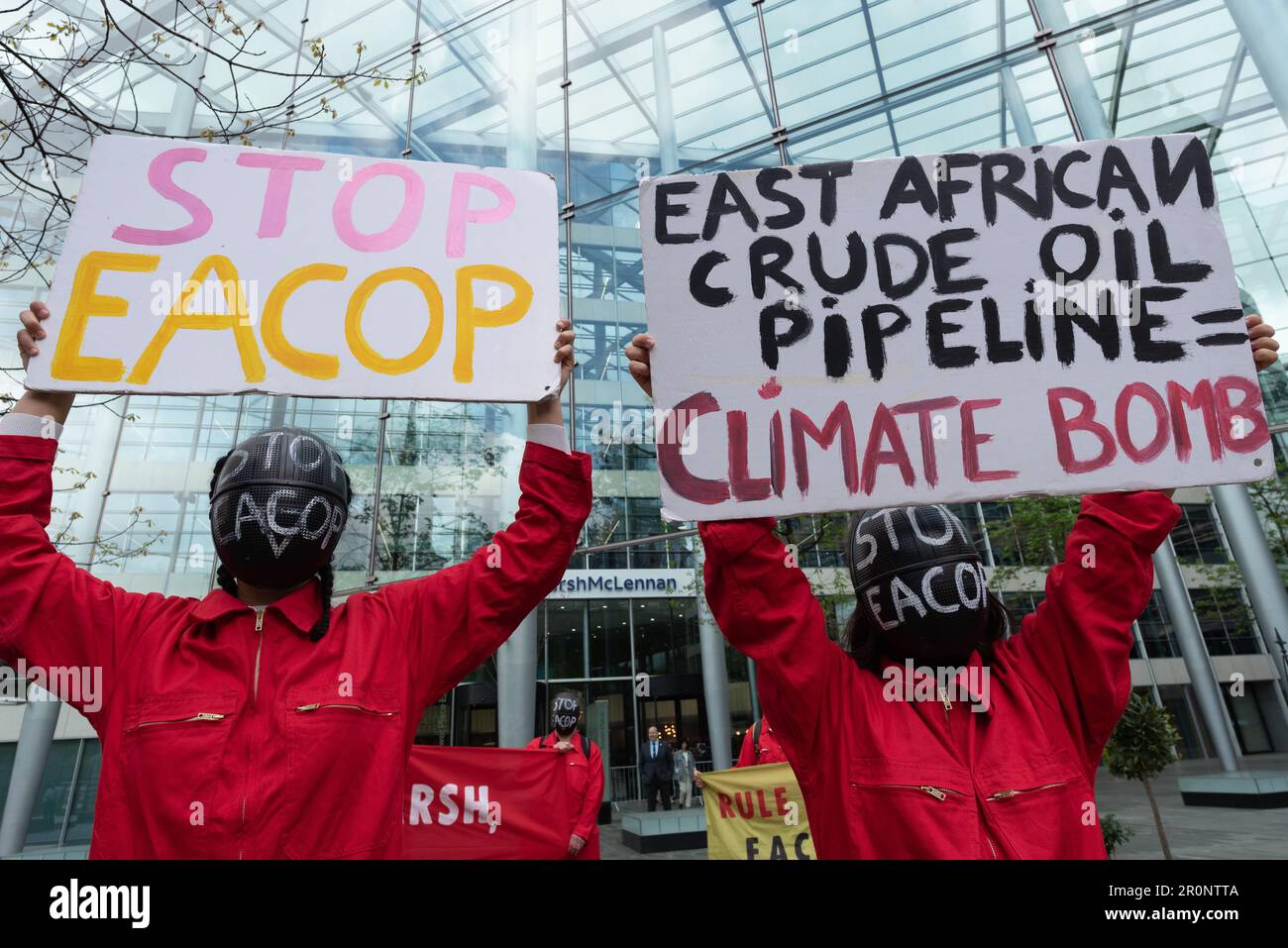 London, UK. 9 May, 2023. Environmental activists protest against the proposed East African Crude Oil Pipeline (EACOP) outside the London office of insurers Marsh McLennan. The controversial pipeline, planned by French oil major Total and the China National Offshore Oil Corporation risks polluting ecosystems and raising CO2 levels further, opponents say, and has seen several banks reject provision of financial support. Credit: Ron Fassbender/Alamy Live News Stock Photo