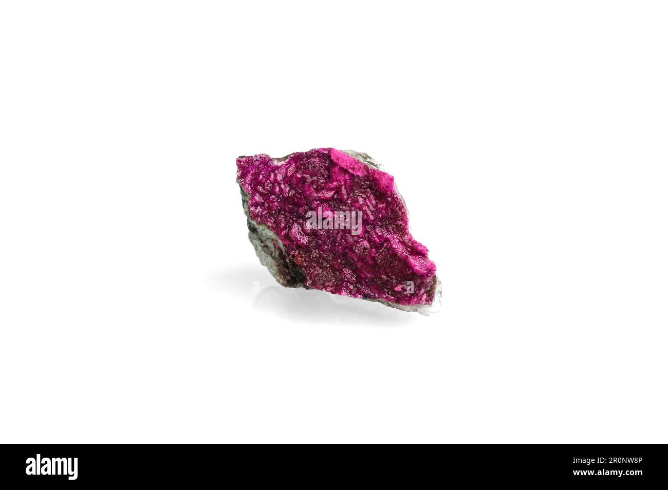 Pink cobalt-bearing dolomite. isolated on white blackground. macro detail background. close-up Rough raw unpolished semi-precious gemstone. Stock Photo