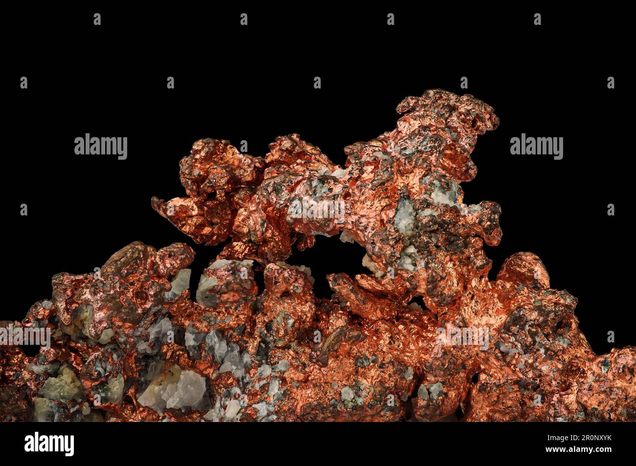 native copper (Cu) with black background. macro detail texture background. close-up raw rough unpolished semi-precious gemstone Stock Photo