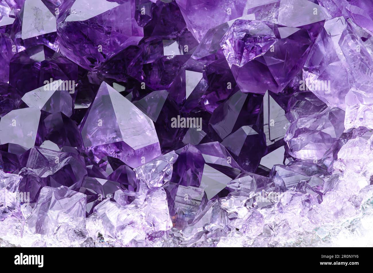 amethyst druse. macro detail texture background. close-up raw rough unpolished semi-precious gemstone Stock Photo