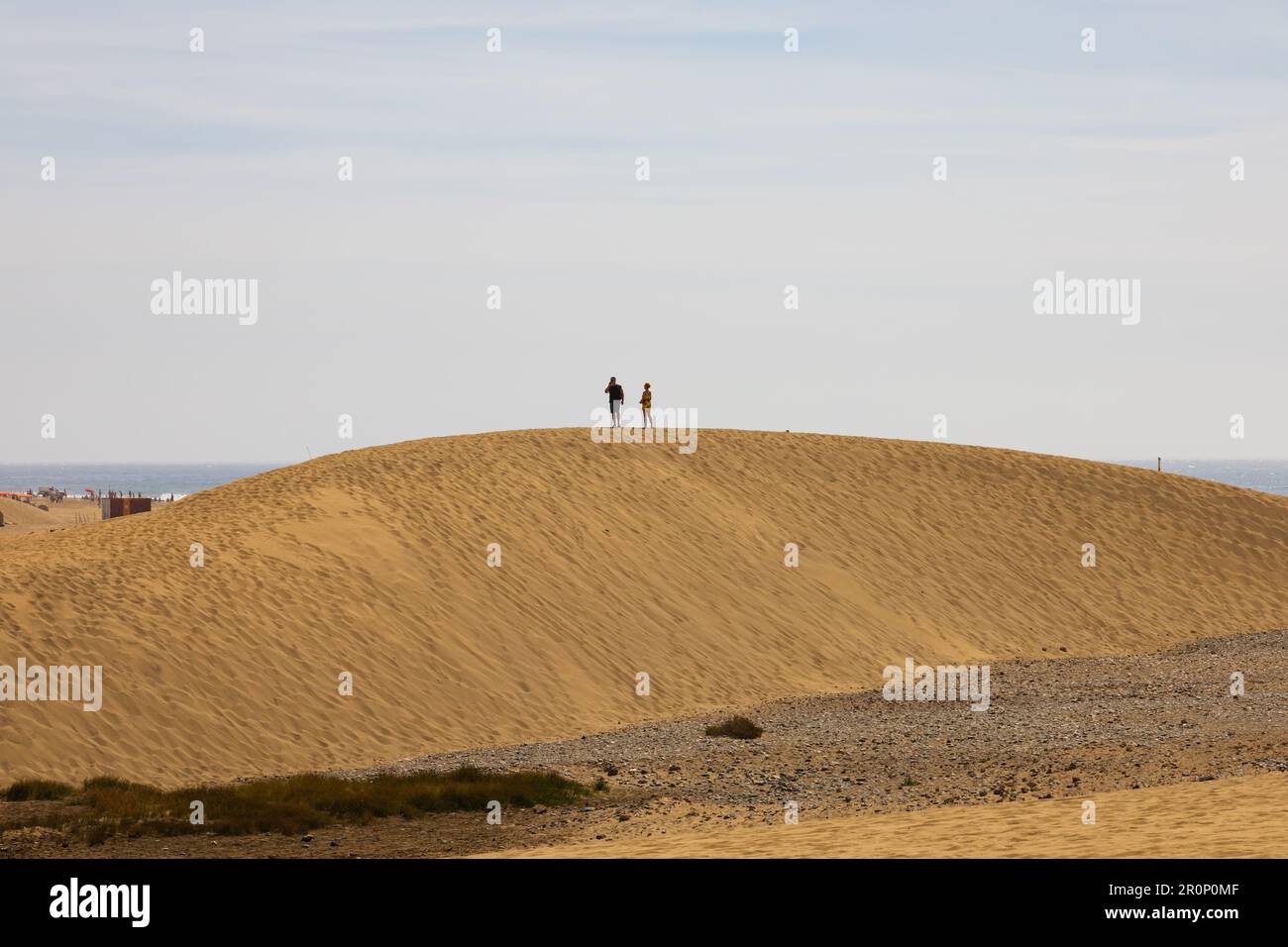 Tourists on the sand at the Dunes at Maspalomas, Dunas de Maspalomas, Las Palmas, Gran Canaria, Spain Stock Photo