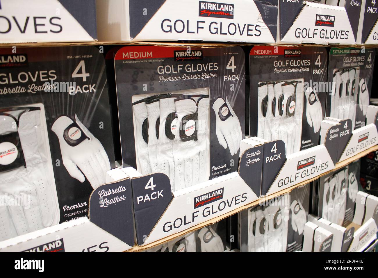 Los Angeles, California, United States - 10-25-2021: A view of several packages of Kirkland Signature golf gloves, on display at a local Costco store. Stock Photo