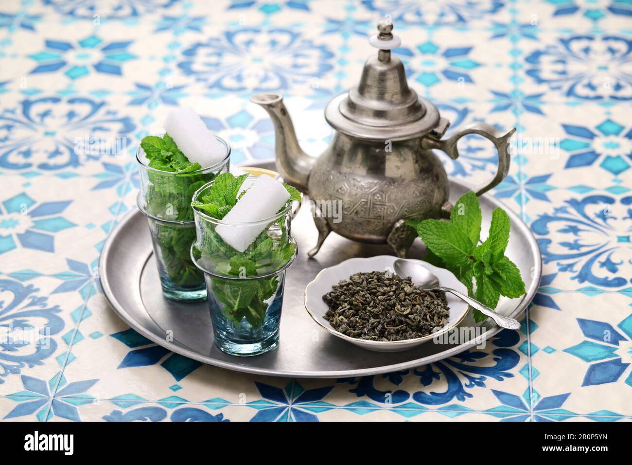 traditional Moroccan mint and sugar tea with a silver teapot Stock Photo