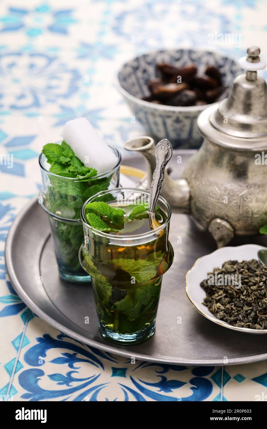 traditional Moroccan mint and sugar tea with a silver teapot Stock Photo