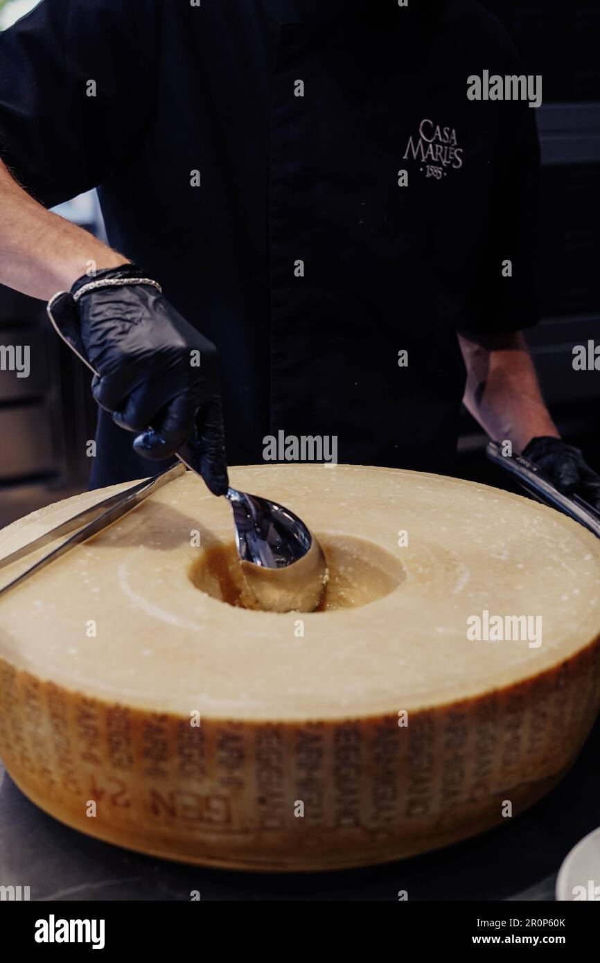wheel of a large Parmesan cheese used to prepare the pasta sauce Stock