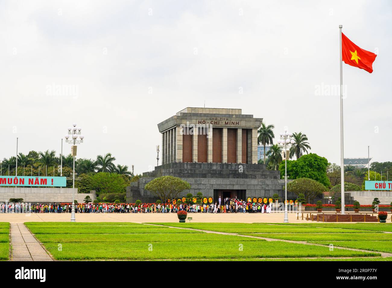 Visitors lining up in a long queue to pay respect to president Ho Chi Minh in the mausoleum in Hanoi, Vietnam. Stock Photo