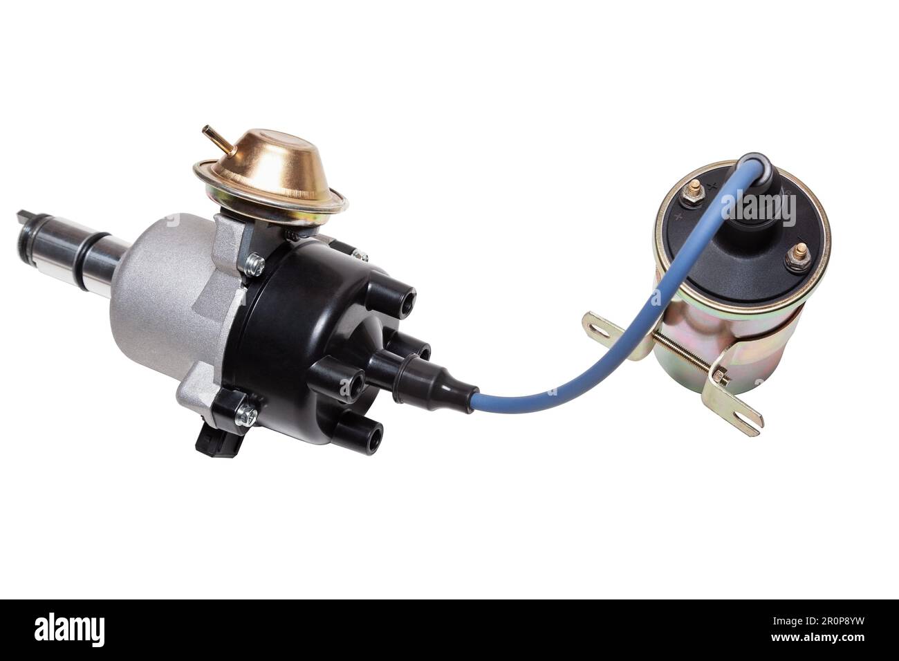 Distributor and ignition coil connected by high voltage wire on a white