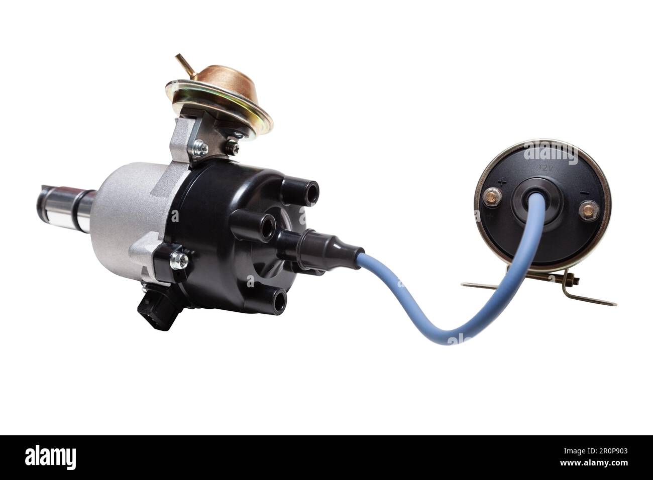 Distributor and ignition coil connected by high voltage wire on a white