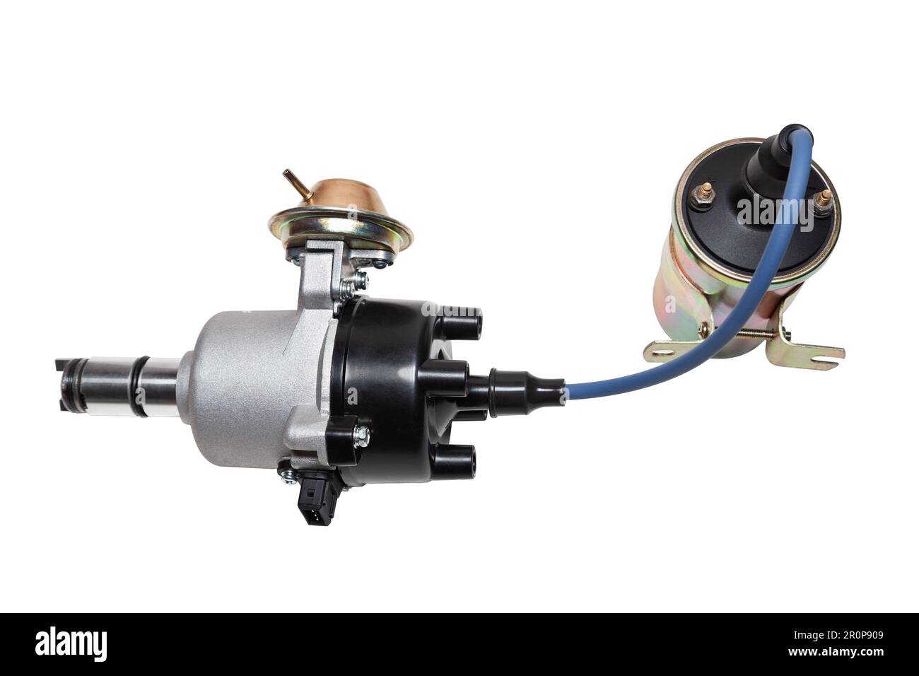 Distributor and ignition coil connected by high voltage wire on a white