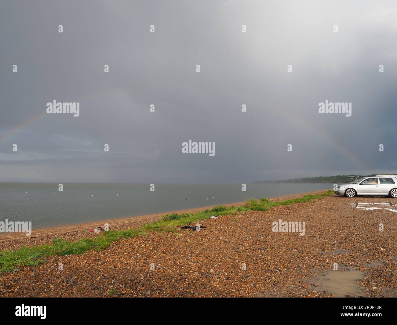 Sheerness, Kent, UK. 9th May, 2023. UK Weather: lightning, storm clouds and a rainbow during a thunderstorm over Sheerness, Kent this evening. Credit: James Bell/Alamy Live News Stock Photo