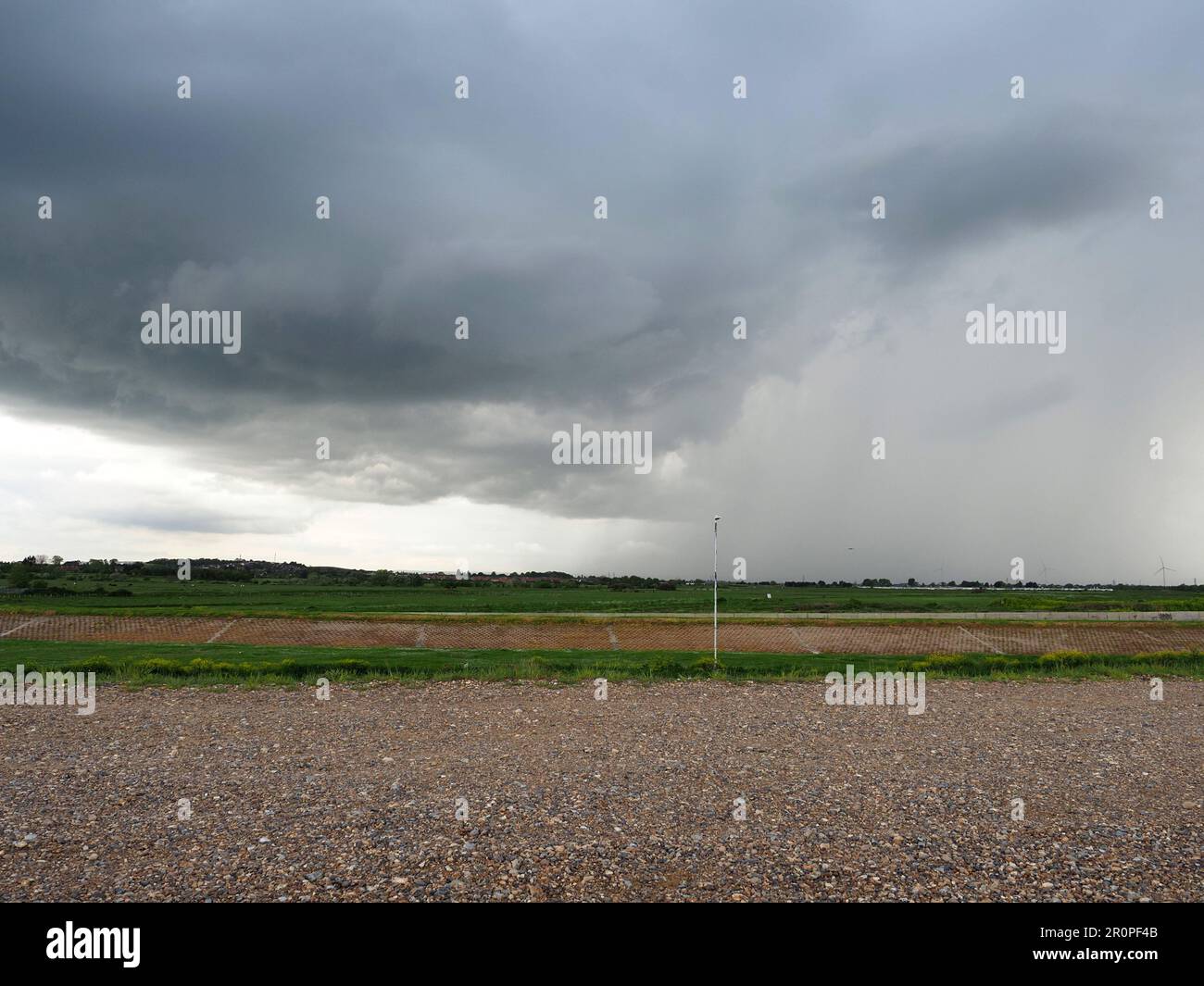 Sheerness, Kent, UK. 9th May, 2023. UK Weather: lightning, storm clouds and a rainbow during a thunderstorm over Sheerness, Kent this evening. Credit: James Bell/Alamy Live News Stock Photo
