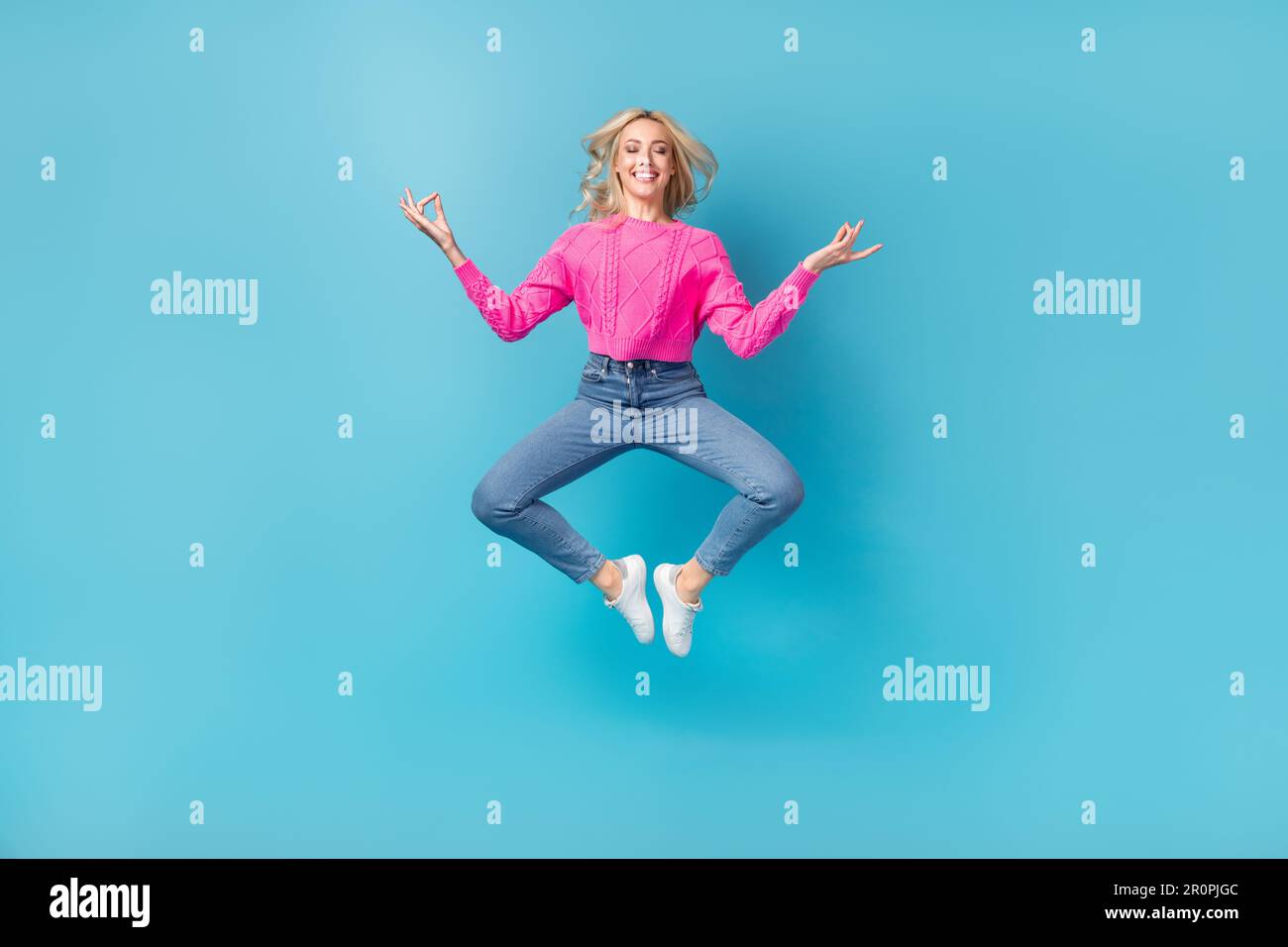 Jumping Balance Full body photo of young relaxed closed eyes woman jumping balance ...