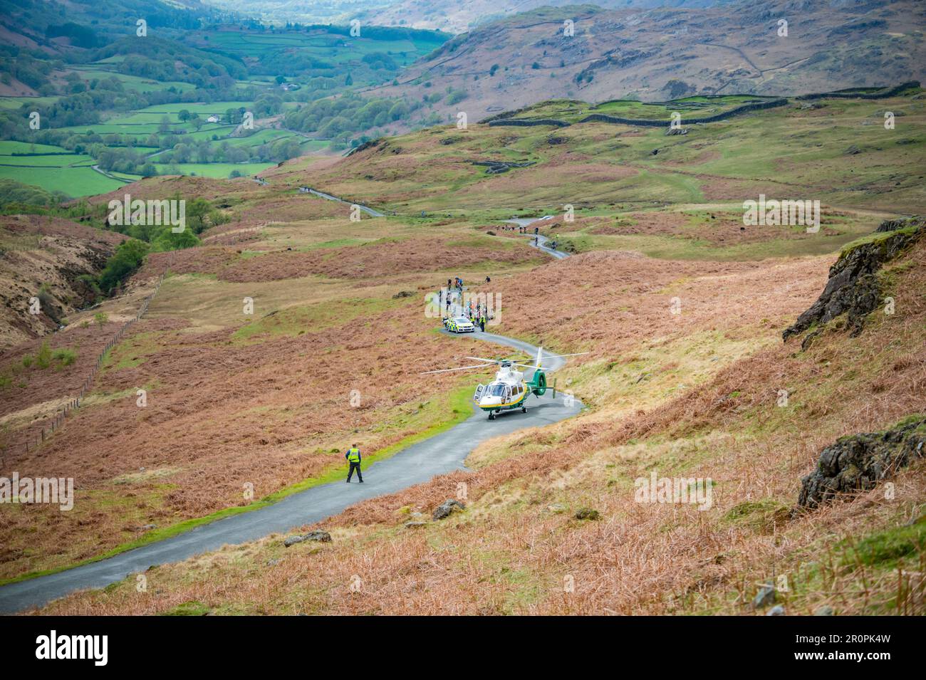 Great North air ambulance attending a callout on Hardknott Pass for an injured cyclist taking part in the Fred Whitton Challenge 2023. Stock Photo