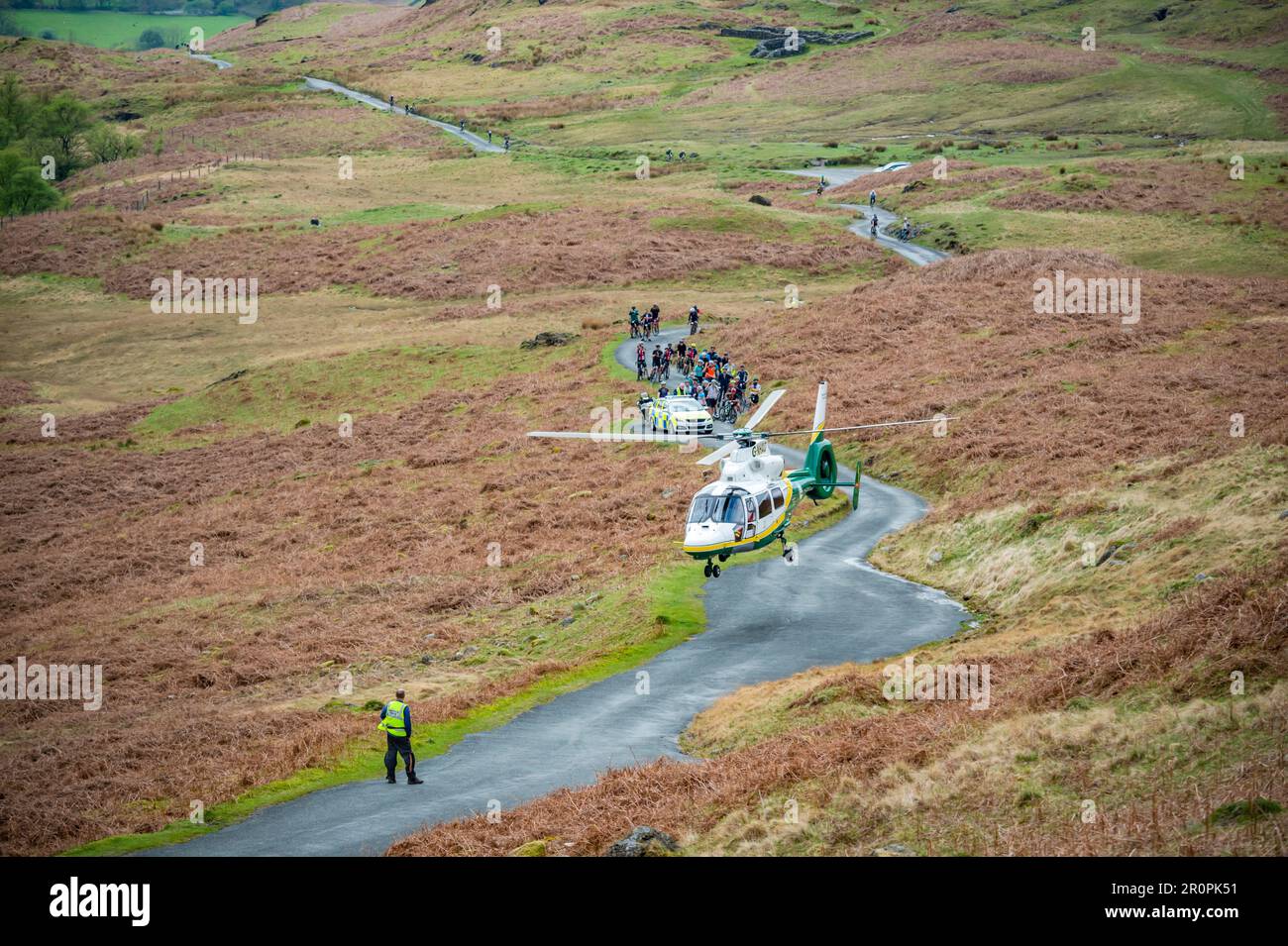 Great North air ambulance attending a callout on Hardknott Pass for an injured cyclist taking part in the Fred Whitton Challenge 2023. Stock Photo