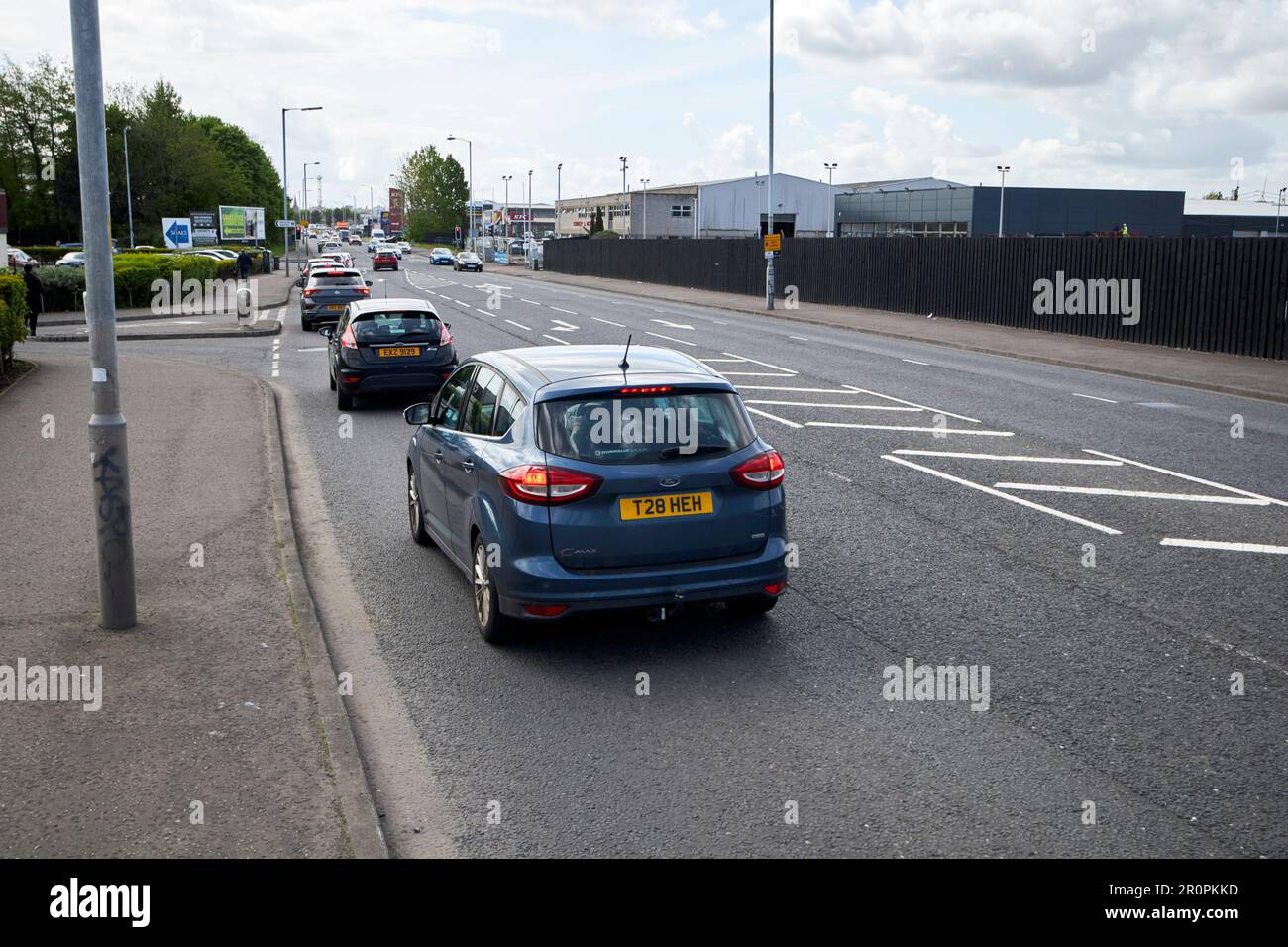 traffic on the busy Boucher road looking away from the city Belfast, Northern Ireland, uk Stock Photo