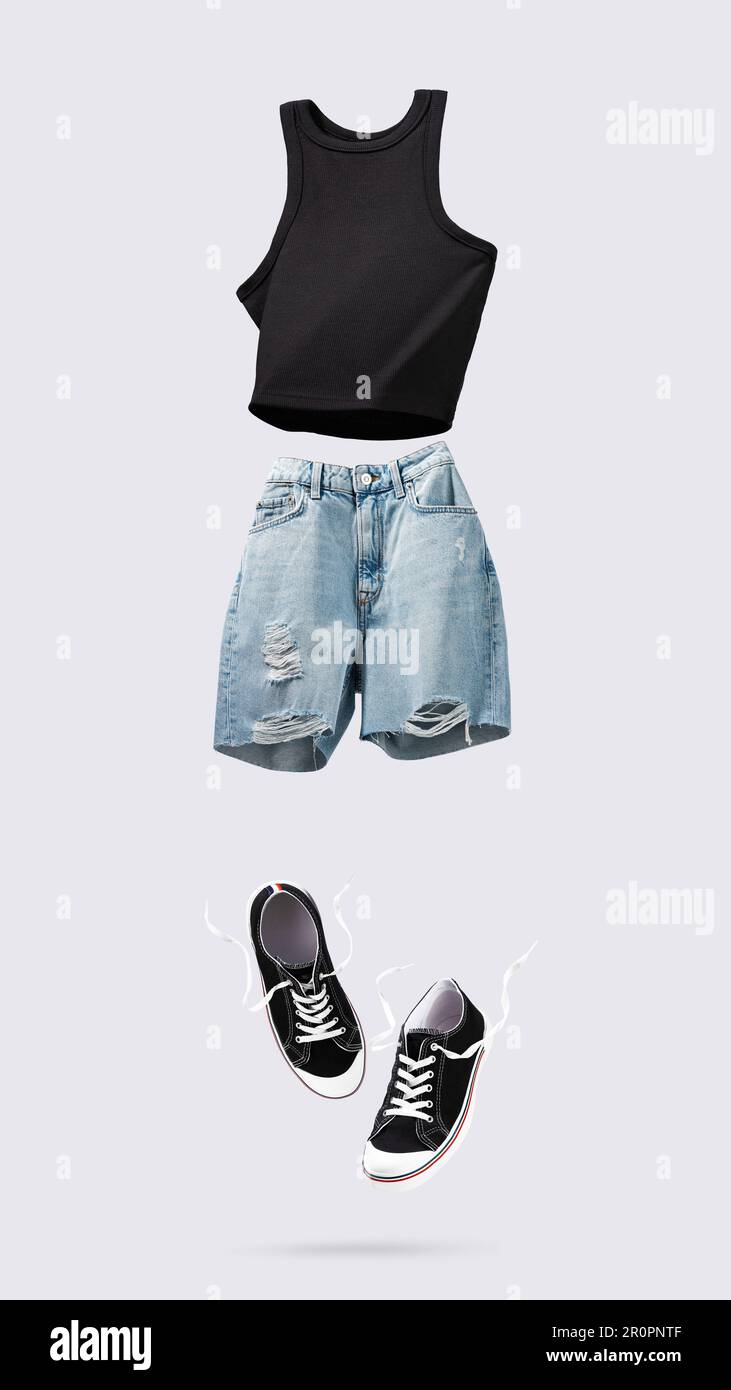 Trendy flying cotton tank top, blue jeans shorts and sneakers isolated