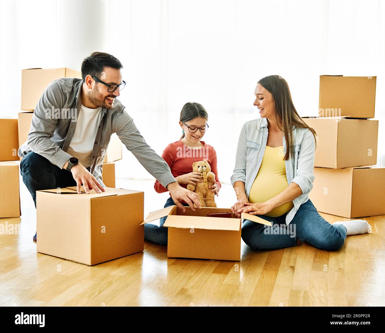child family box home house moving happy apartment pregnant mother