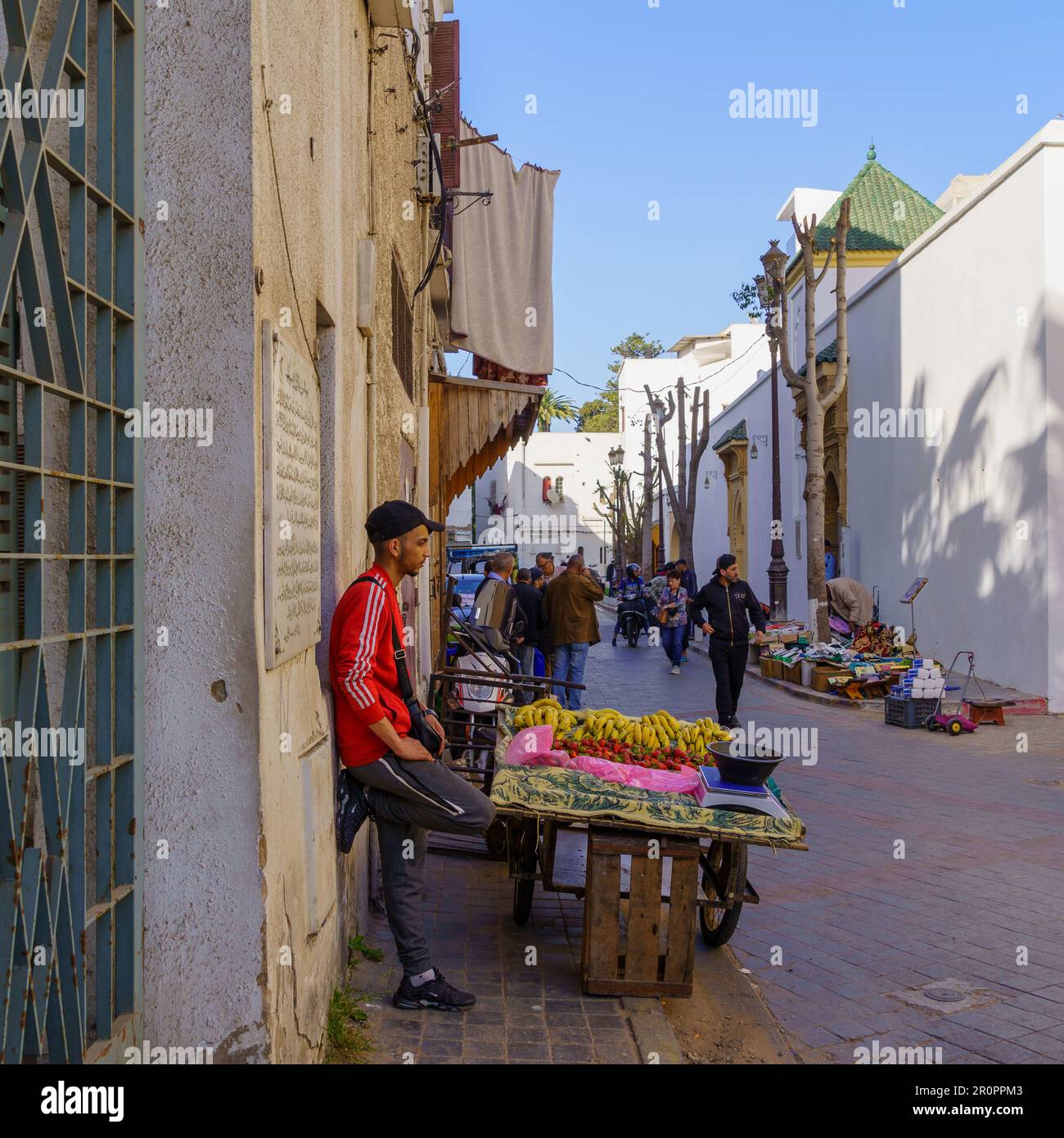 Casablanca, Morocco - March 29, 2023: Street scene with seller and visitors, in the market of the Old Medina, Casablanca, Morocco Stock Photo