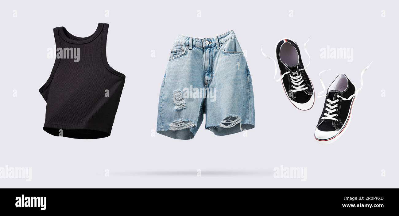 Trendy flying cotton tank top, blue jeans shorts and sneakers isolated
