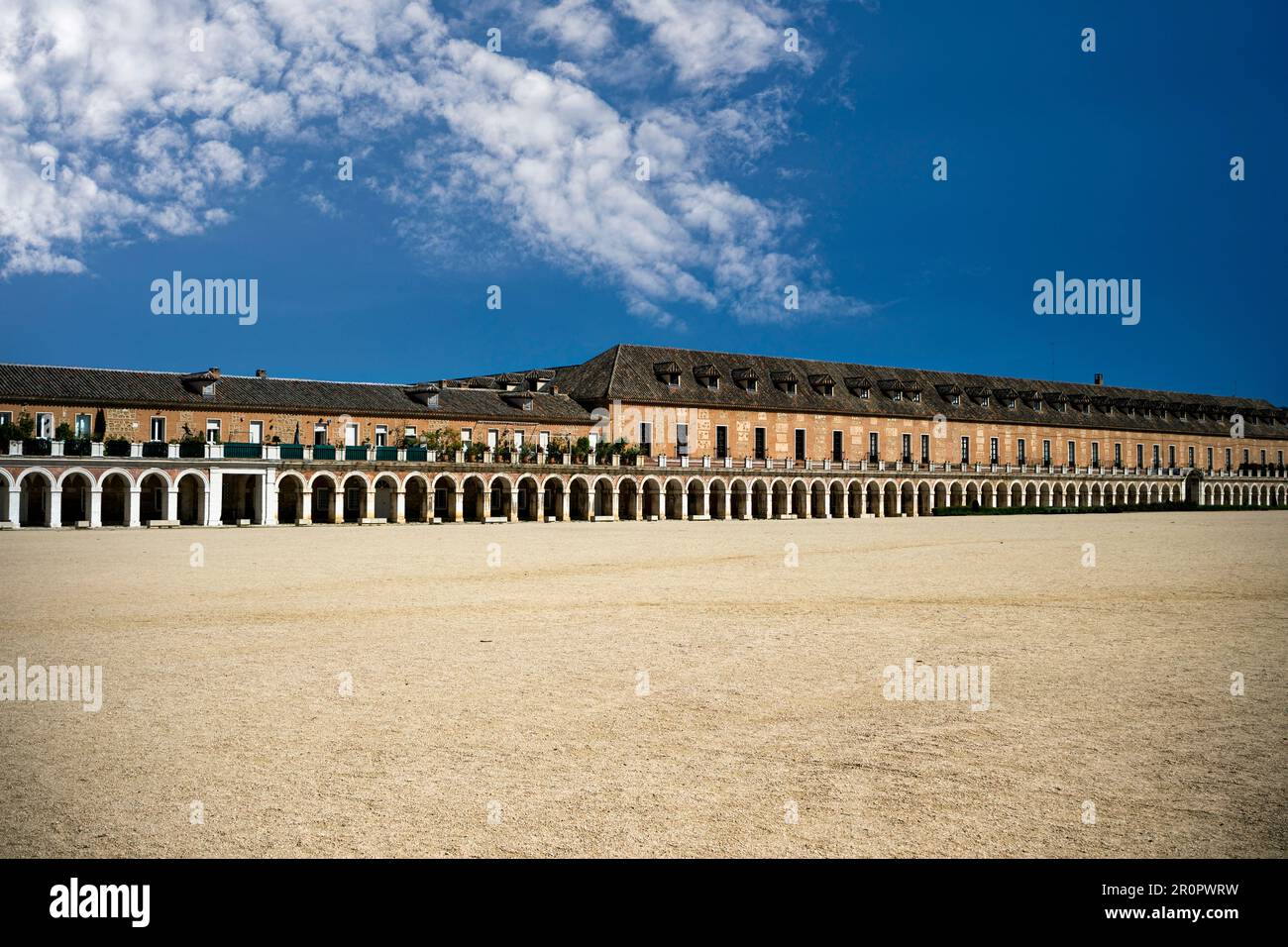 Plaza de Parejas next to the Royal Palace of Aranjuez, Madrid, Spain with a historic porticoed building in the background Stock Photo