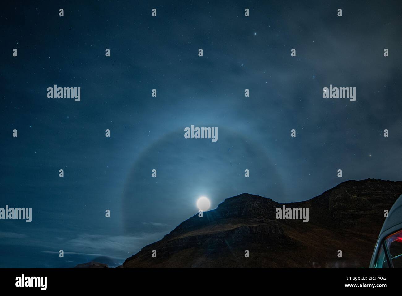 A scenic view of the Moon halo with a mountain in the foreground. Stock Photo