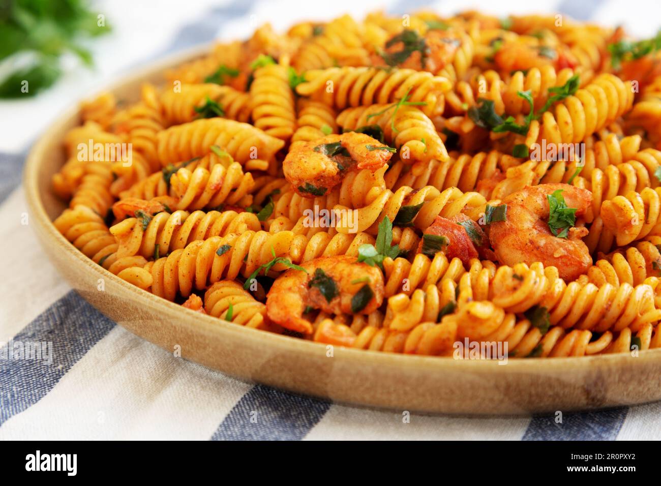 Homemade Creamy Tomato Shrimp Rotini Pasta with Parsley on a Plate, low