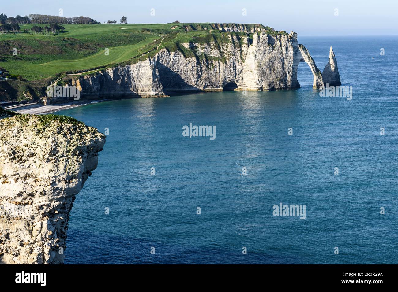 Etretat between historic city, beach of pebbles and cliffs on the cote ...