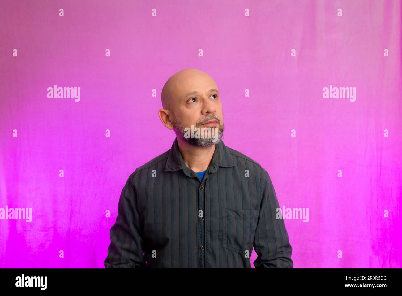 Portrait of a serious 50yearold man with a beard and bald head
